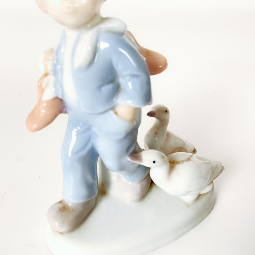 Porcelain Boy with Goose Figurine